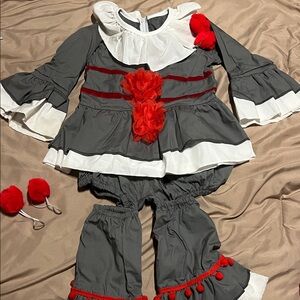 Gray and White Ruffled Costume with Red Accents